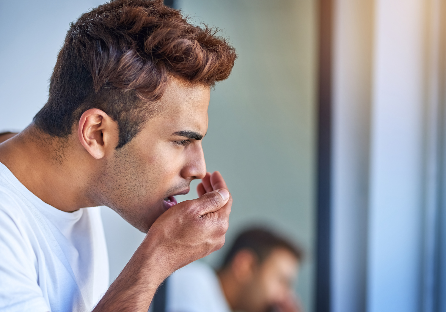 symptoms of bad breath